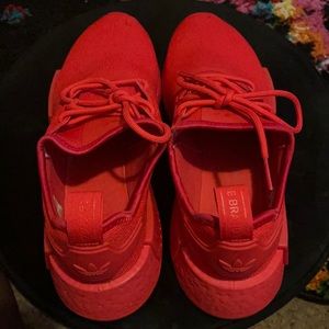 Adidas red sneakers. Worn once. Dirt mark at toe.